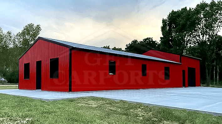 Bold blue barndominium with vertical roof, dual roll-up doors, and attached open front lean-to porch — Get Carports